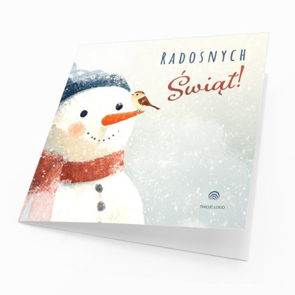 Okładka firmowej kartki świątecznej Przyjaciel Bałwanka z bałwanem w granatowej czapce i rudzikiem na marchewkowym nosie.